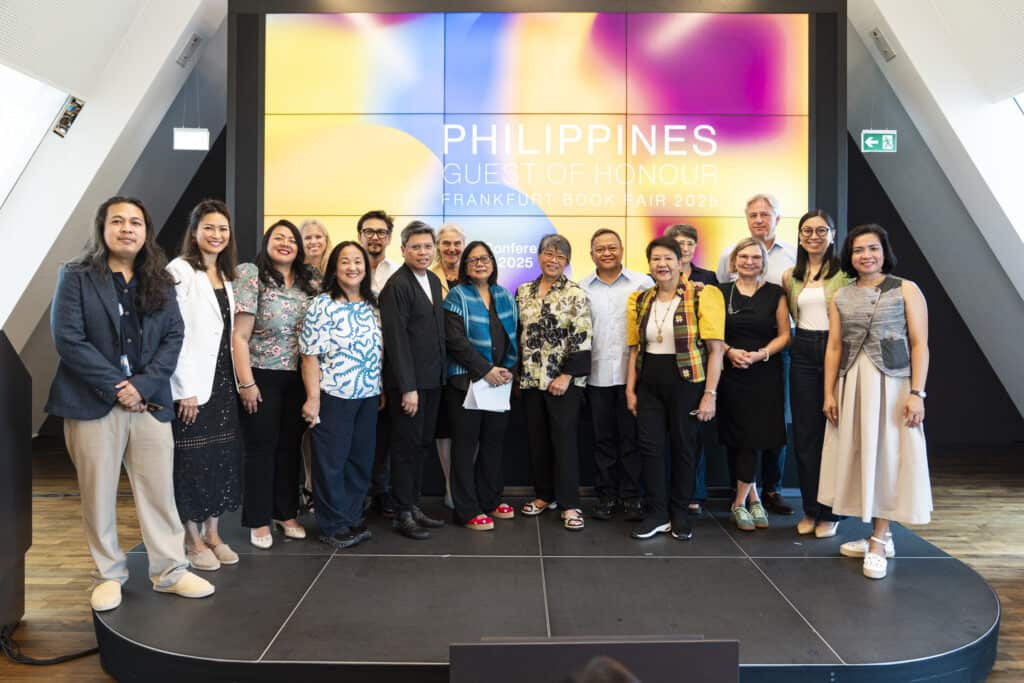 A group of people stand on a stage in front of a screen displaying “Philippines Guest of Honour Frankfurt Book Fair 2025.”