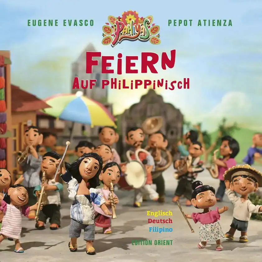 Clay figures of people celebrating with musical instruments and banners in a festive outdoor scene. The text reads “Feiern auf Philippinisch” and mentions three languages: English, German, Filipino.