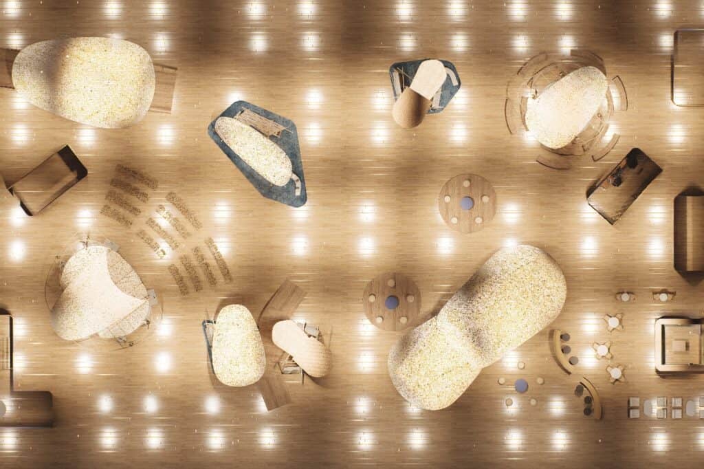 Overhead view of a spacious, modern interior with illuminated wooden floors, large curved seating areas, circular tables, and scattered lighting fixtures.